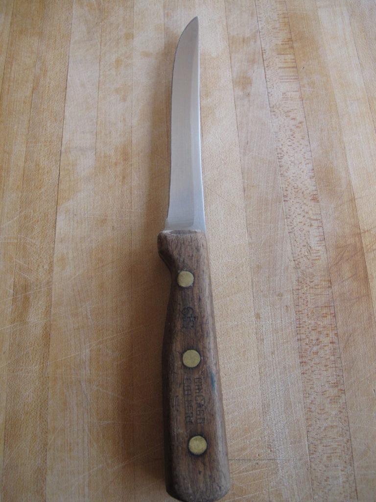 Boning knife on a cutting board