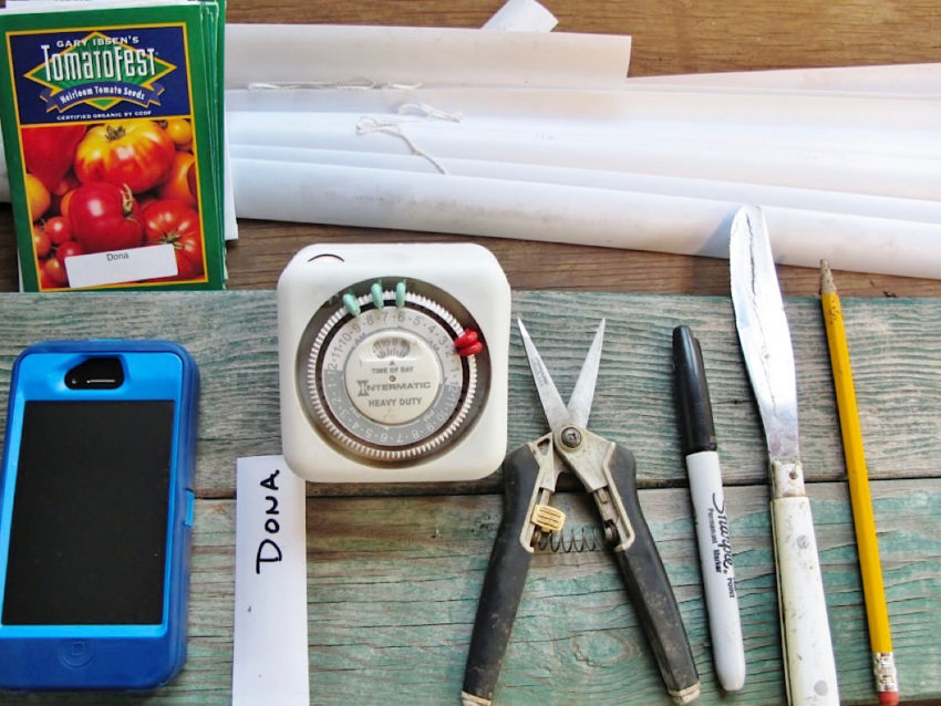 Helpful tools to use when starting your plants from seed. phone, plant tags, timer for lights, mini-clippers, sharpie, bread knife.