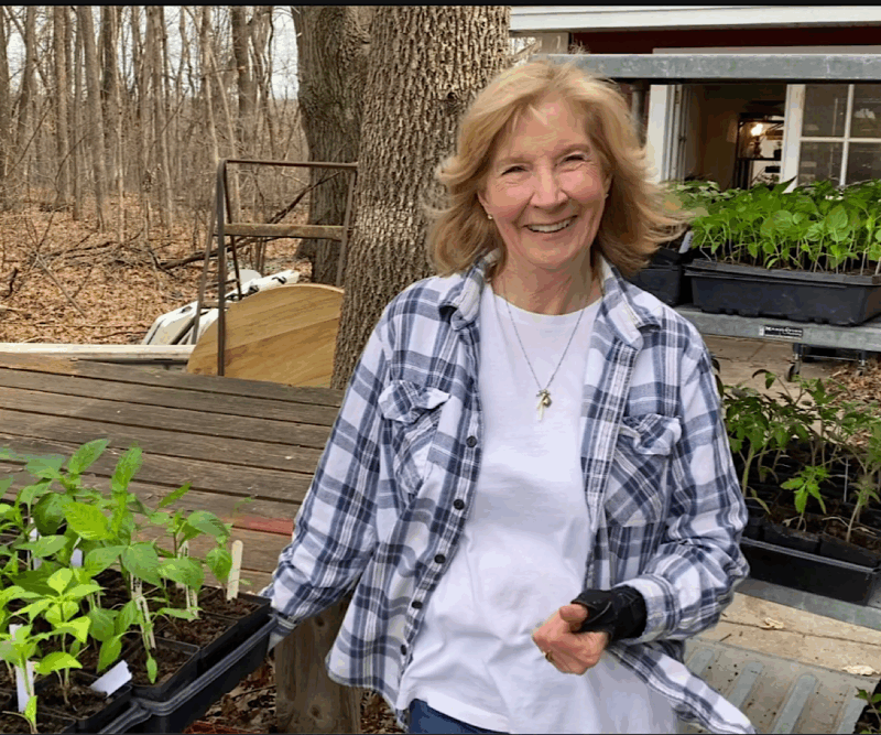 Dorothy Stainbrook with pepper seedlings ready to be hardened off.