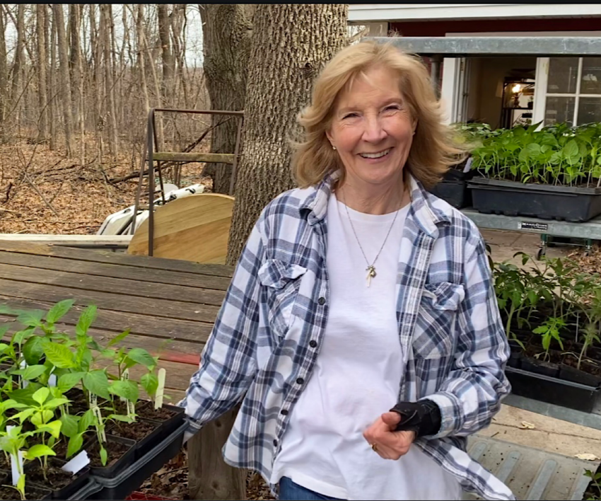 Dorothy with pepper seedlings ready to be hardened off.