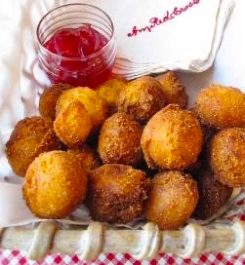 Basket of hush puppies with raspberry hot pepper jelly