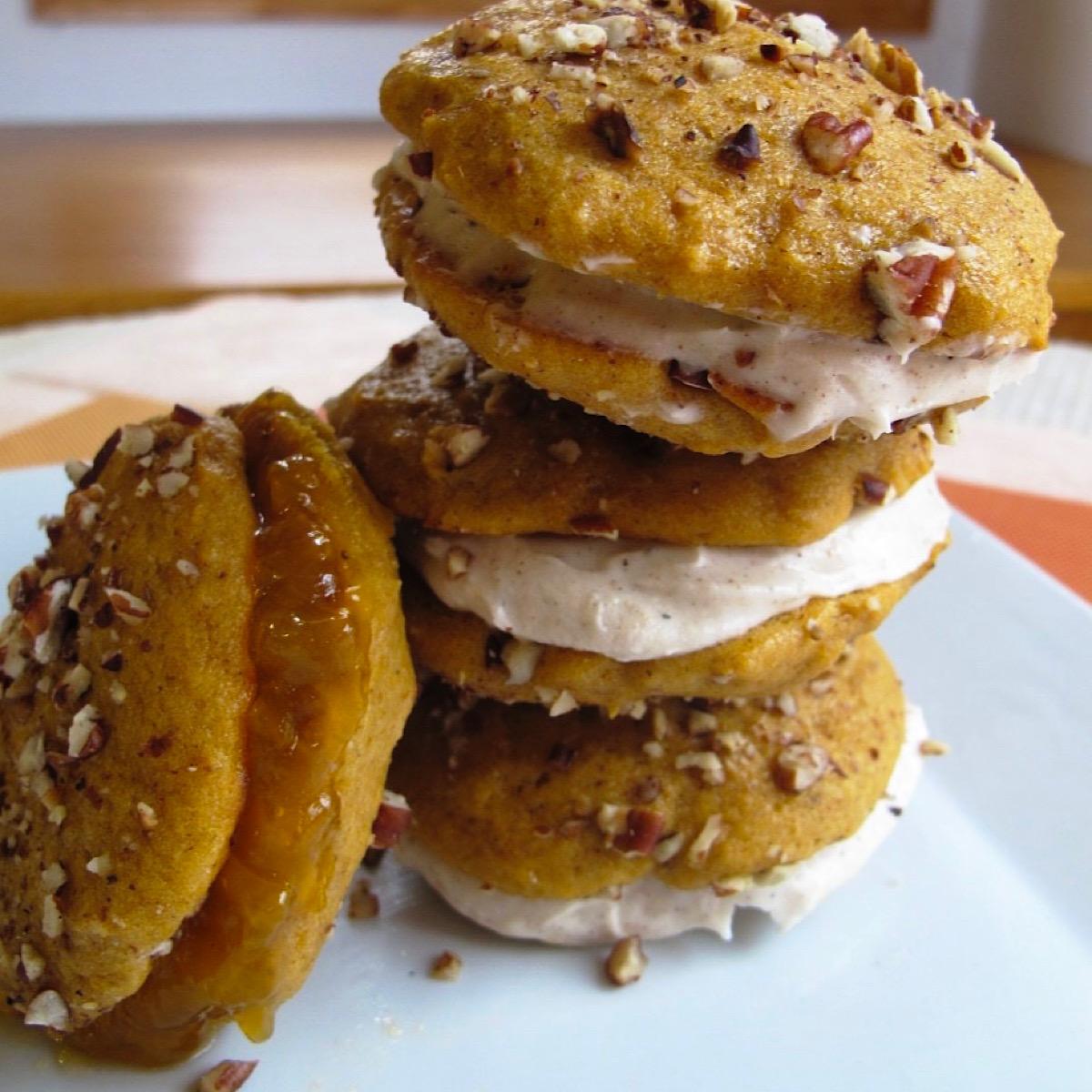 Four pumpkin whoopie pies with chai spice filling