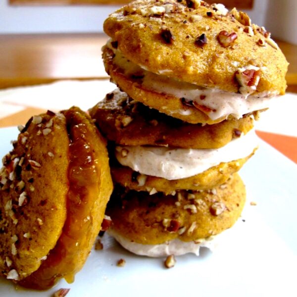 Pumpkin chai whoopie pies; stacked atop each other.