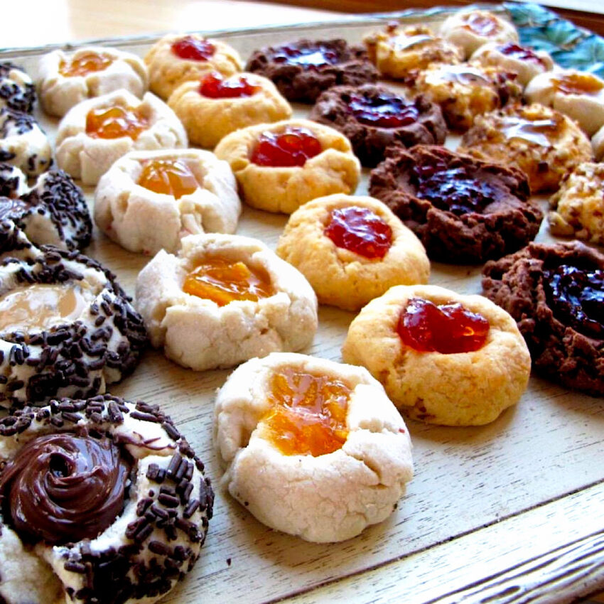 Tray of 5 different varieties of thumbprint cookies.