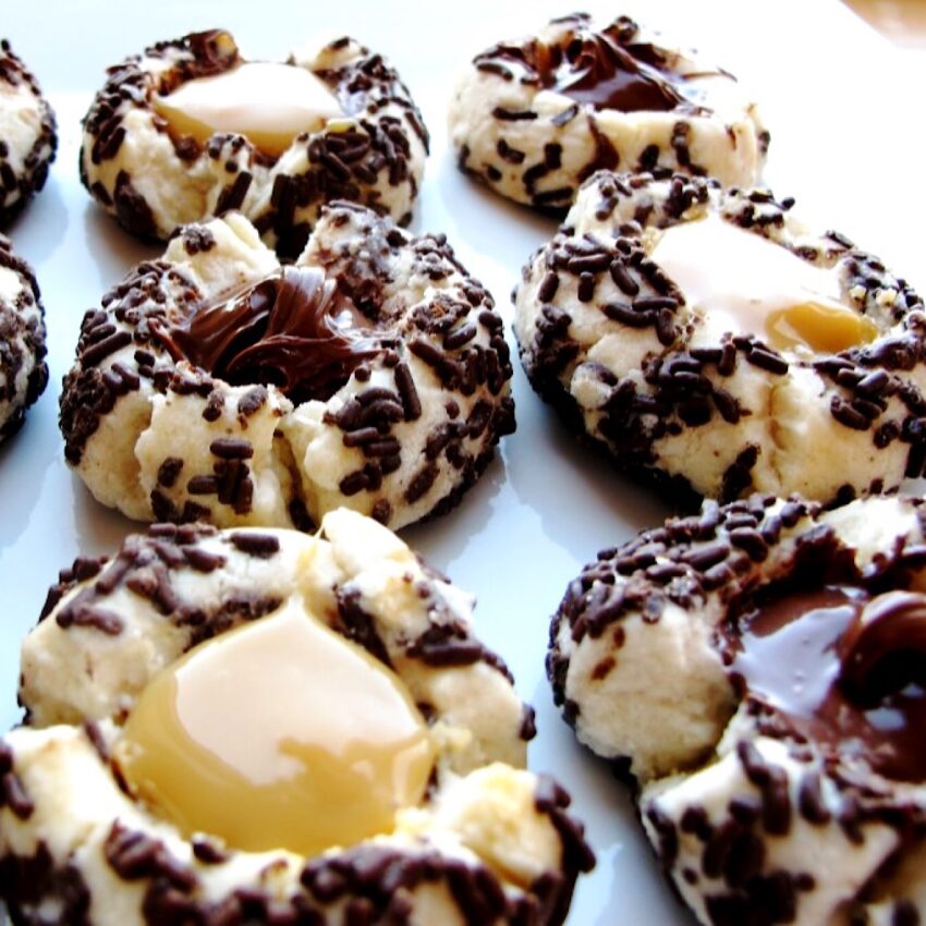 Thumbprint cookies with chocolate sprinkles and tres leche and nutella fillings.