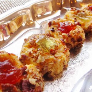 Cheddar parmesan thumbprint cookies with hot pepper jelly filling.