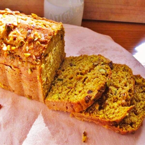 Loaf of pumpkin amaretto  bread with  nut crust.