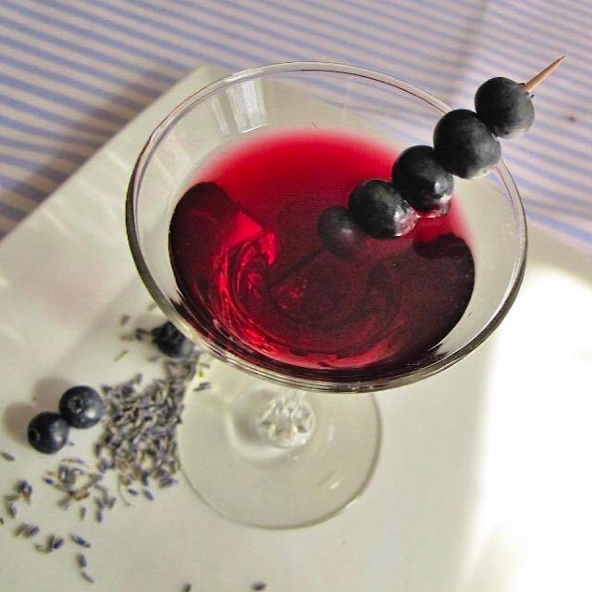 Blueberry martini made with blueberry tarragon shrub syrup