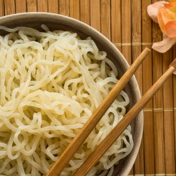 Bowl of shirataki noodles with chopsticks.