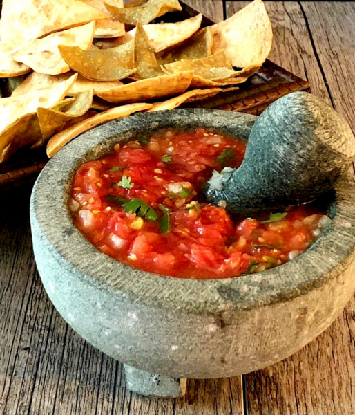 Salsa rojo made in a molcajete (mortar and pestle).