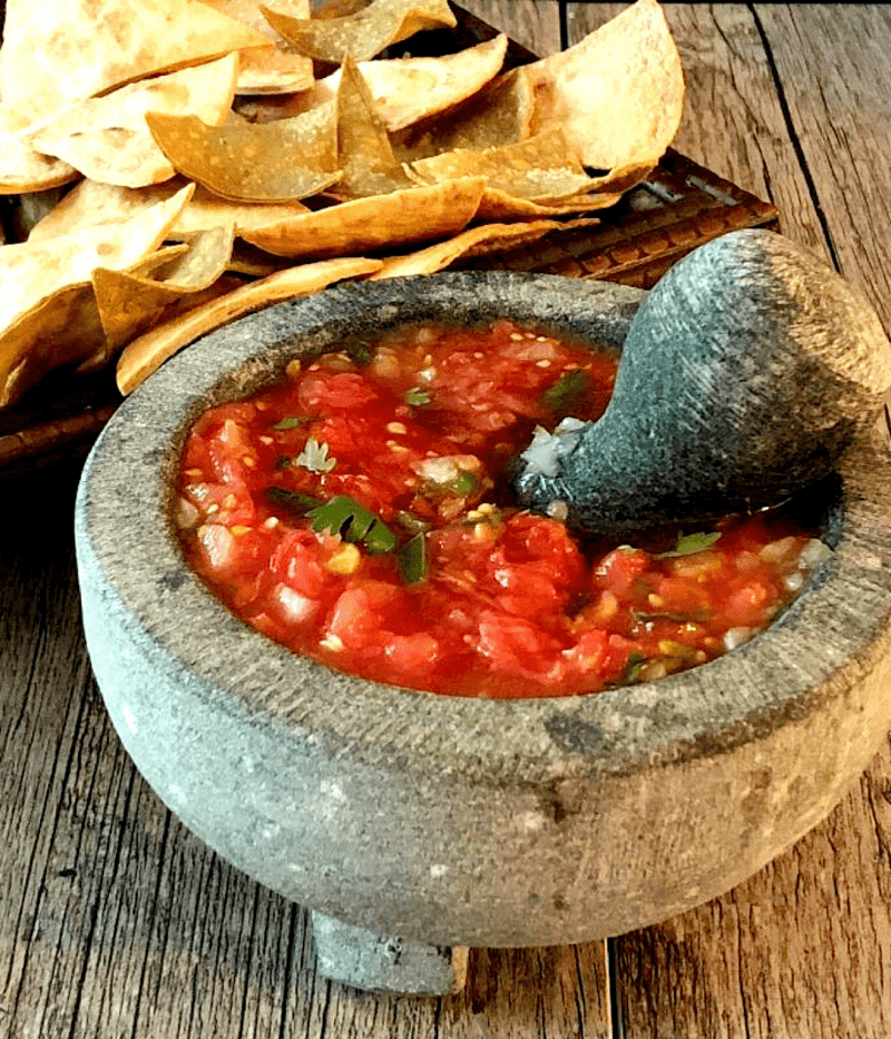 Salsa rojo made in a molcajete (mortar and pestle).