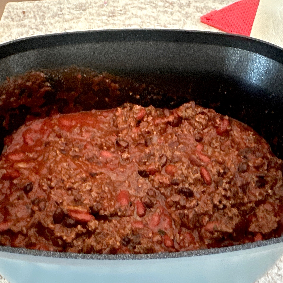 Beef and bean chile in a crockpot.