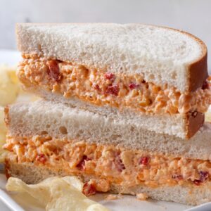 Pimento sandwich halves stacked on top of each other.
