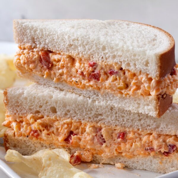Pimento sandwich halves stacked on top of each other.