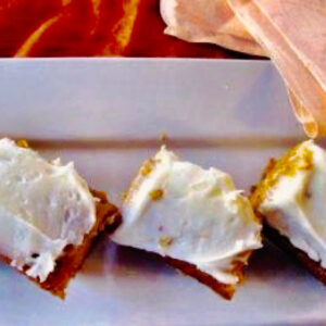 Cream cheese frosting on pumpkin bars
