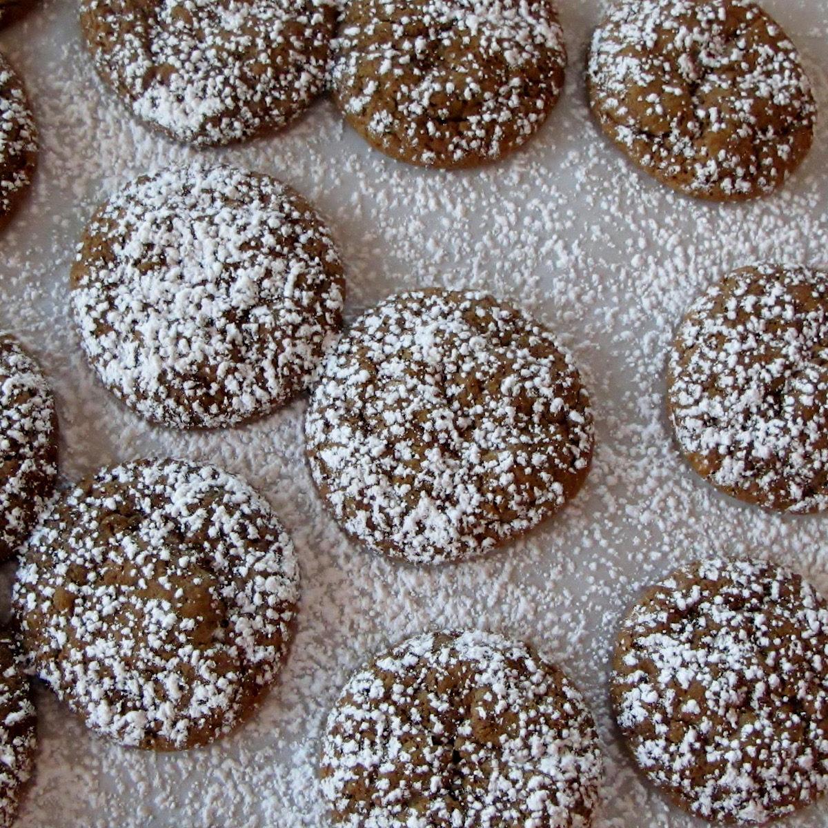 Dusted pfeffernusse Christmas cookies on counter