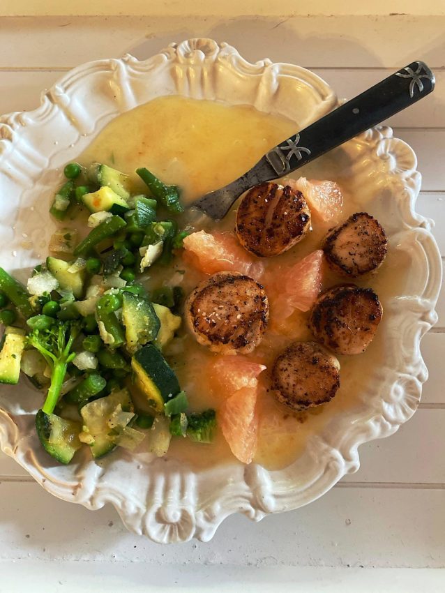 Low carb dinner of seared scallops in grapefruit butter sauce