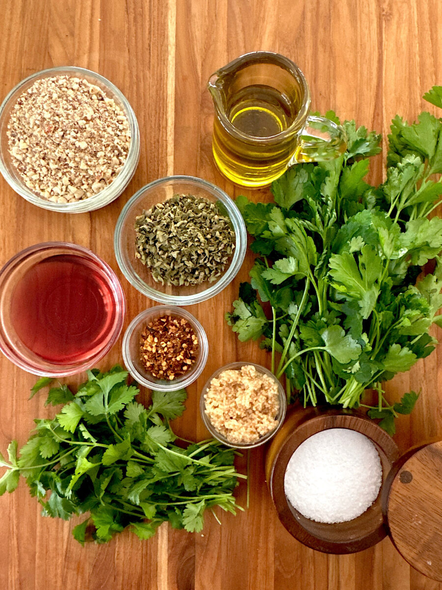 Ingredients for chimichurri sauce with toasted almonds.
