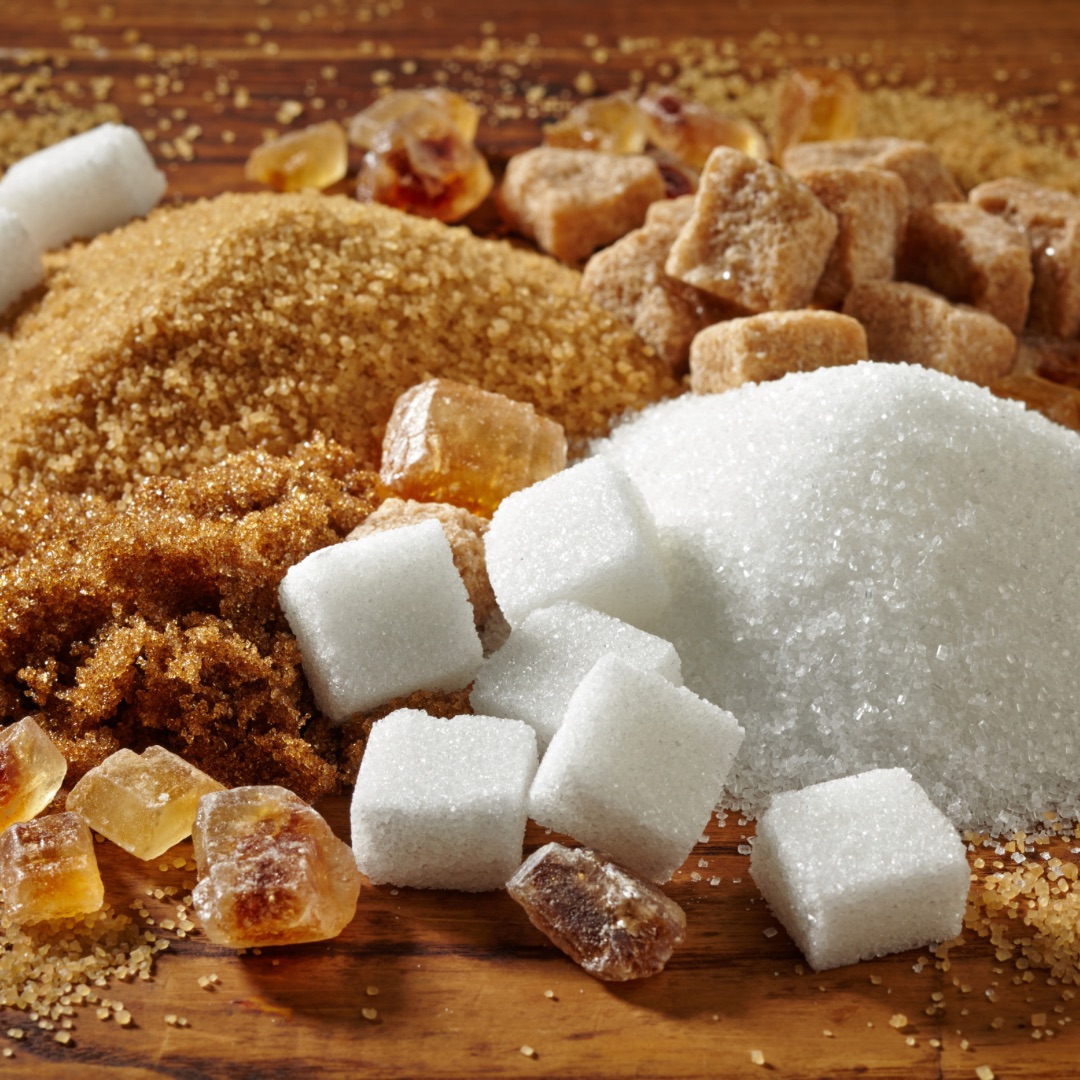 Sugar in various forms and kinds, including brown sugar and sugar cubes.
