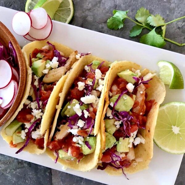 Homemade low carb tortillas filled with various taco fillings.