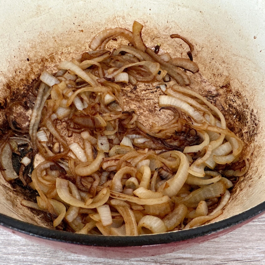 Caramelized sliced onions in a dutch oven.