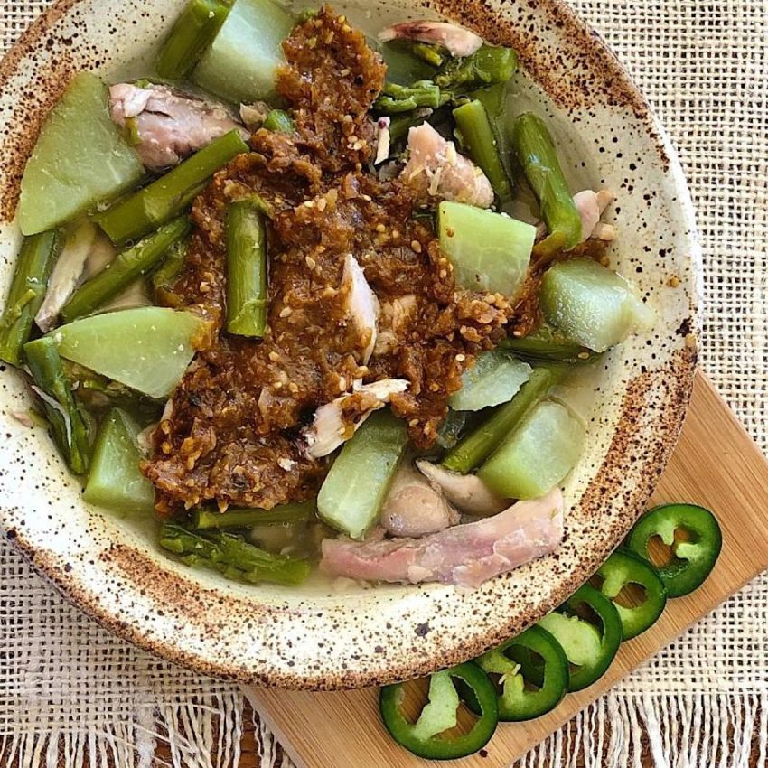 Bowl of chicken with yellow mole and chayote