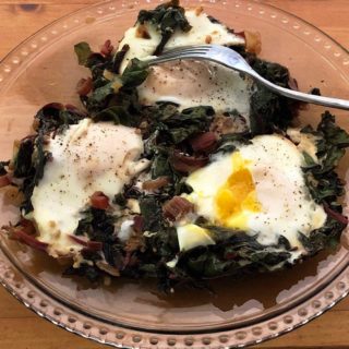 Swiss chard with nested eggs