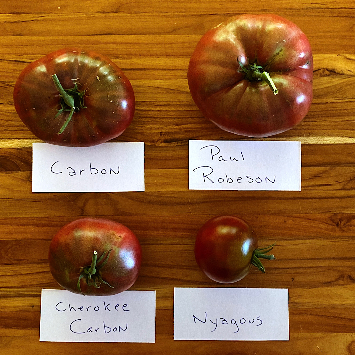 Four varieties of “black” heirloom tomatoes
