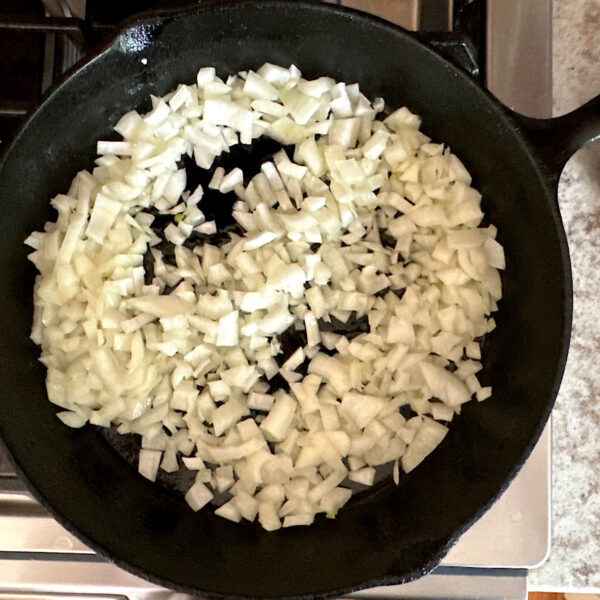 Chopped onion in a cast  iron skillet