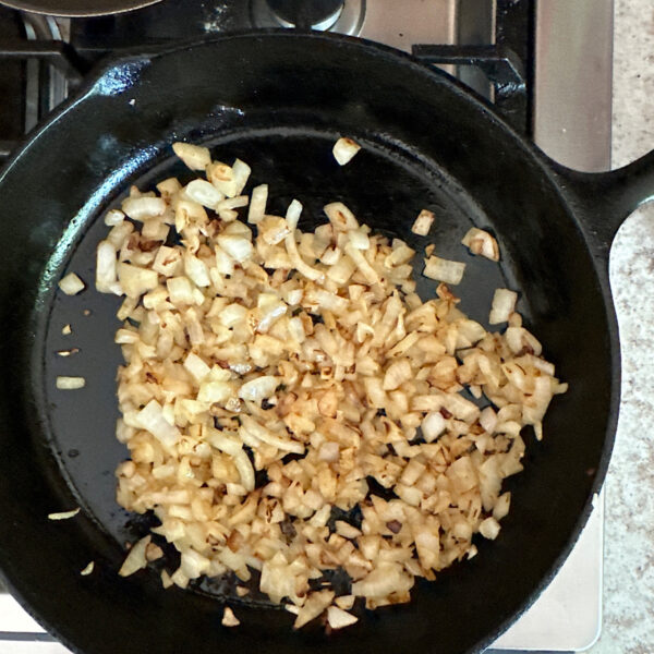Caramelized chopped onions in cast iron skillet