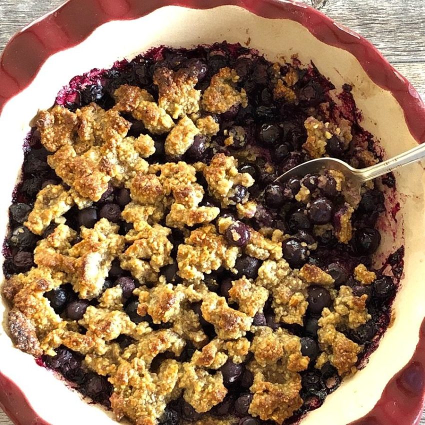 Low Carb Blueberry Crumble in clay pie plate