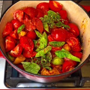 Pot of ingredients for making low carb freezer tomato sauce with fresh tomatoes
