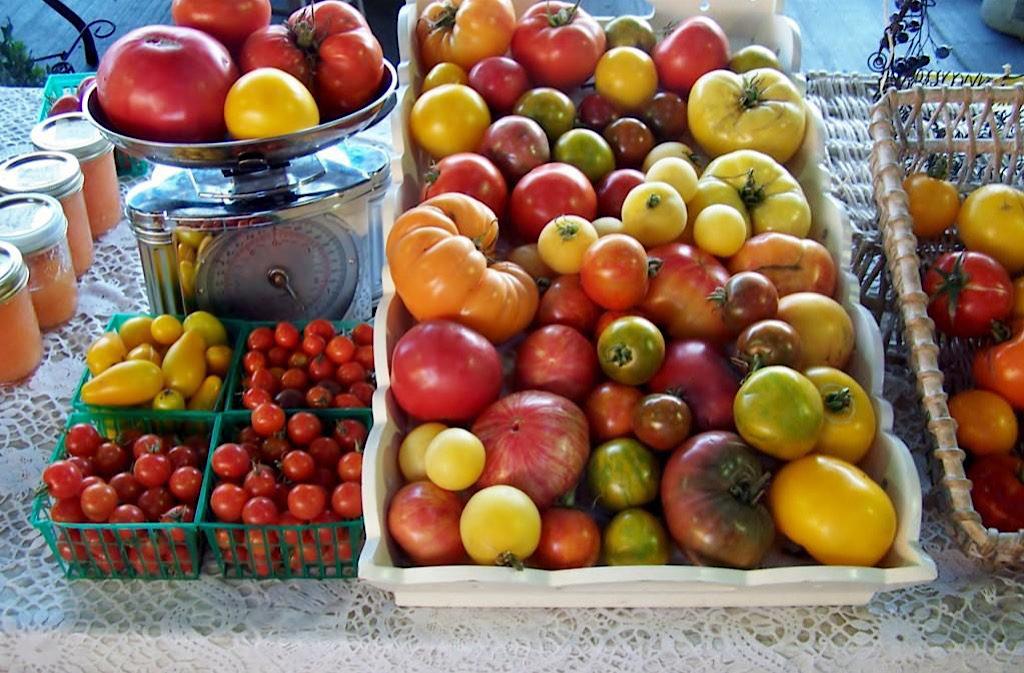 Baskets of different varieties of heirloom tomatoes
