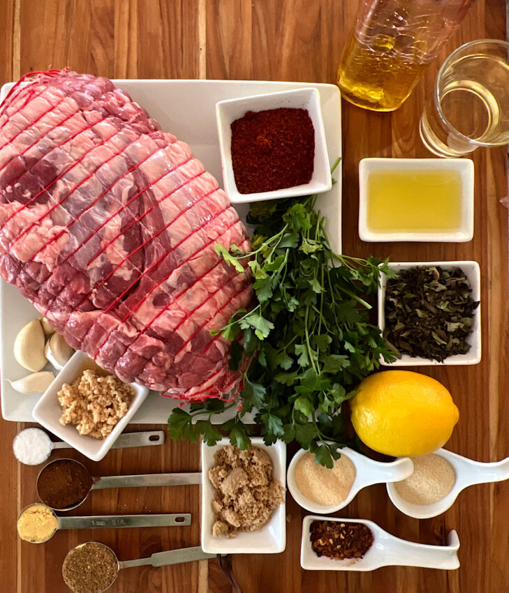 Ingredients for a roast lamb with sumac rub and mint-chimichurri sauce