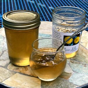 8 oz jar and closeup of dandelion jelly