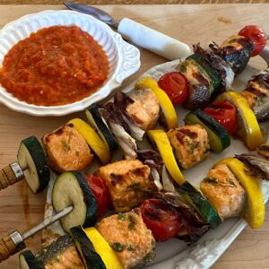Salmon and vegetable kebabs with ajvar dipping sauce