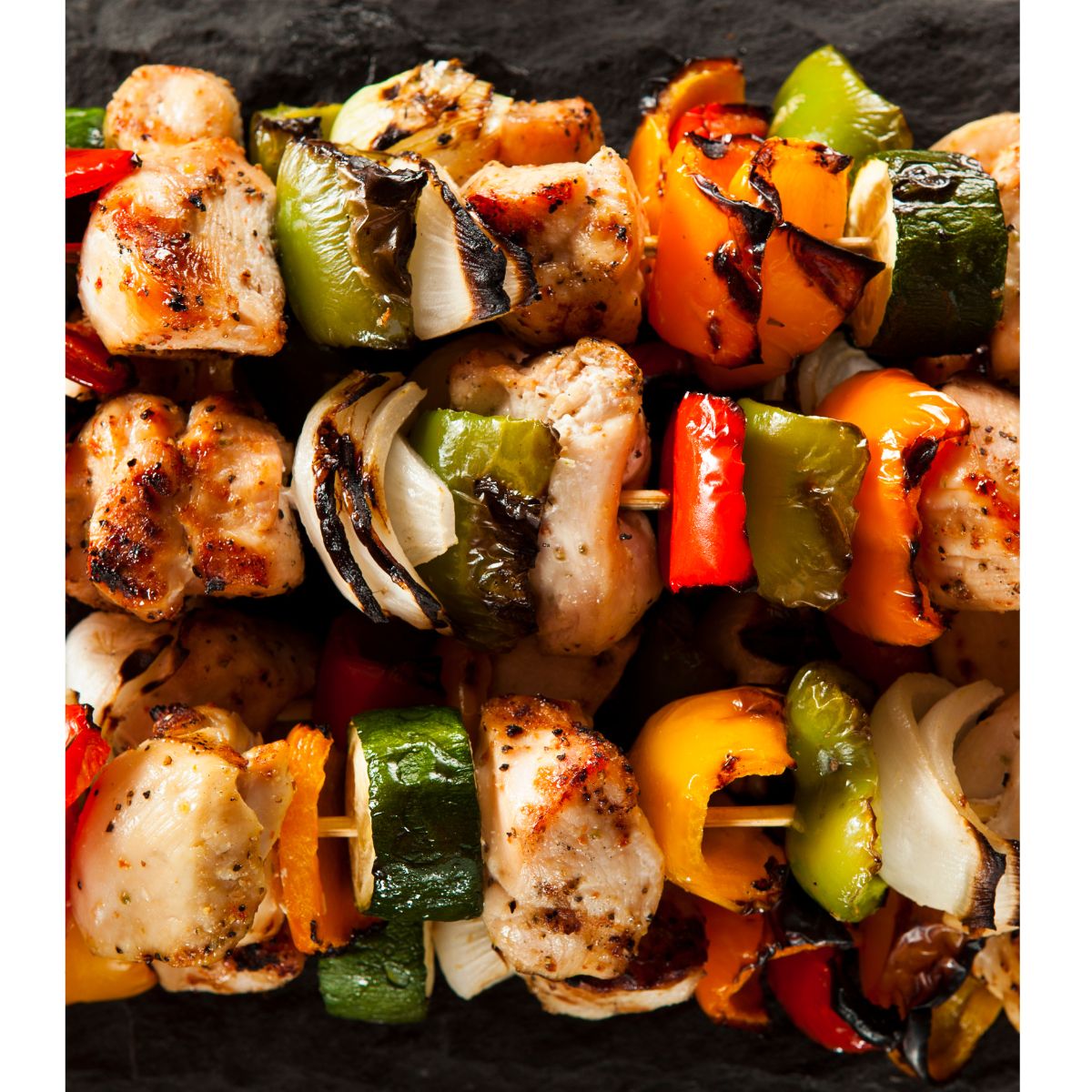Chicken and vegetables on skewers.