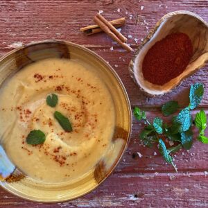 Bowl of Pumpkin Ancho Soup with Mint garnish