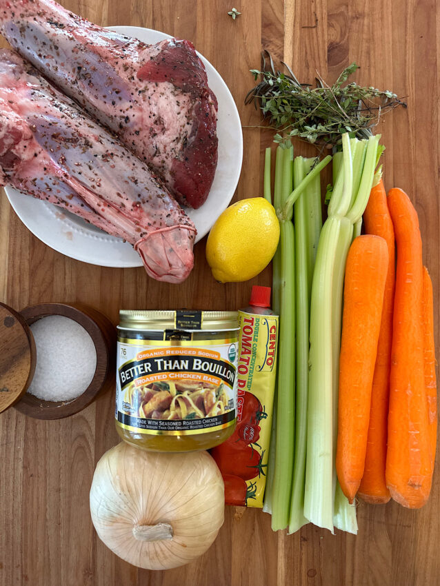 Ingredients for osso buco with lamb shanks, carrots, celery, onion, tomato paste and chicken broth.