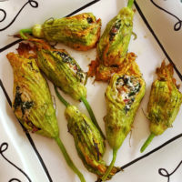 Baked or roasted squash blossoms with swiss chard and ricotta