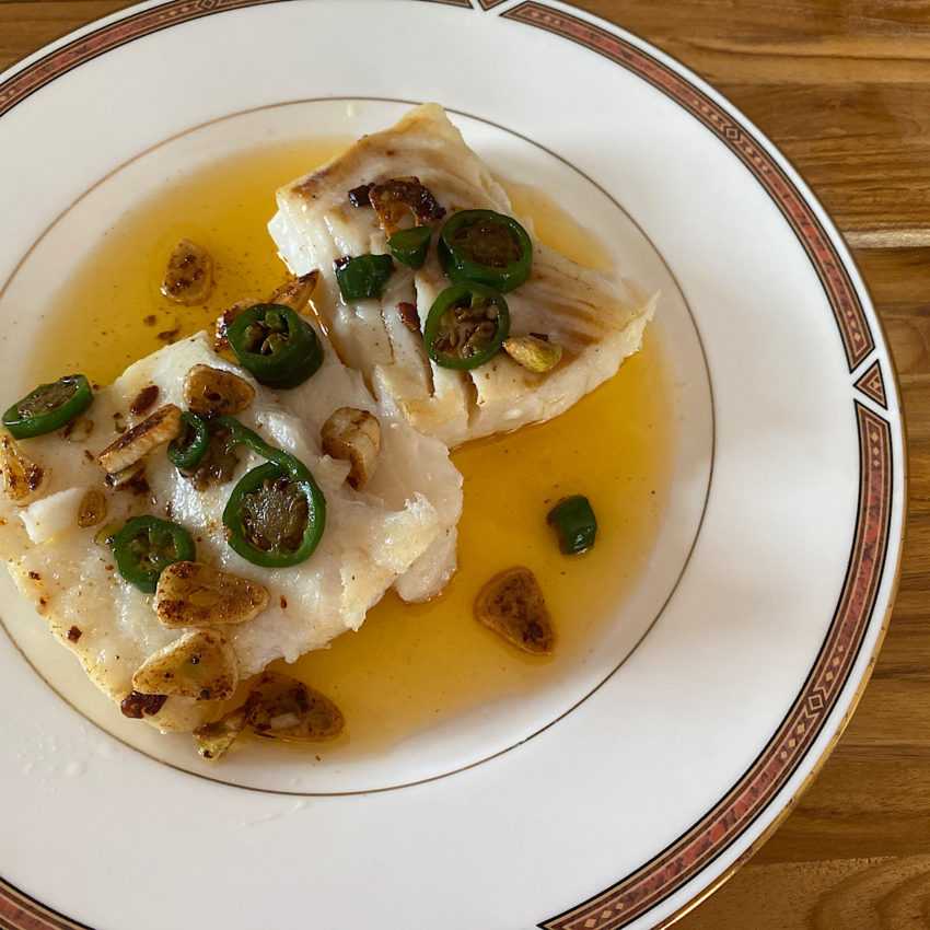 Two filets of cod with pil pil sauce