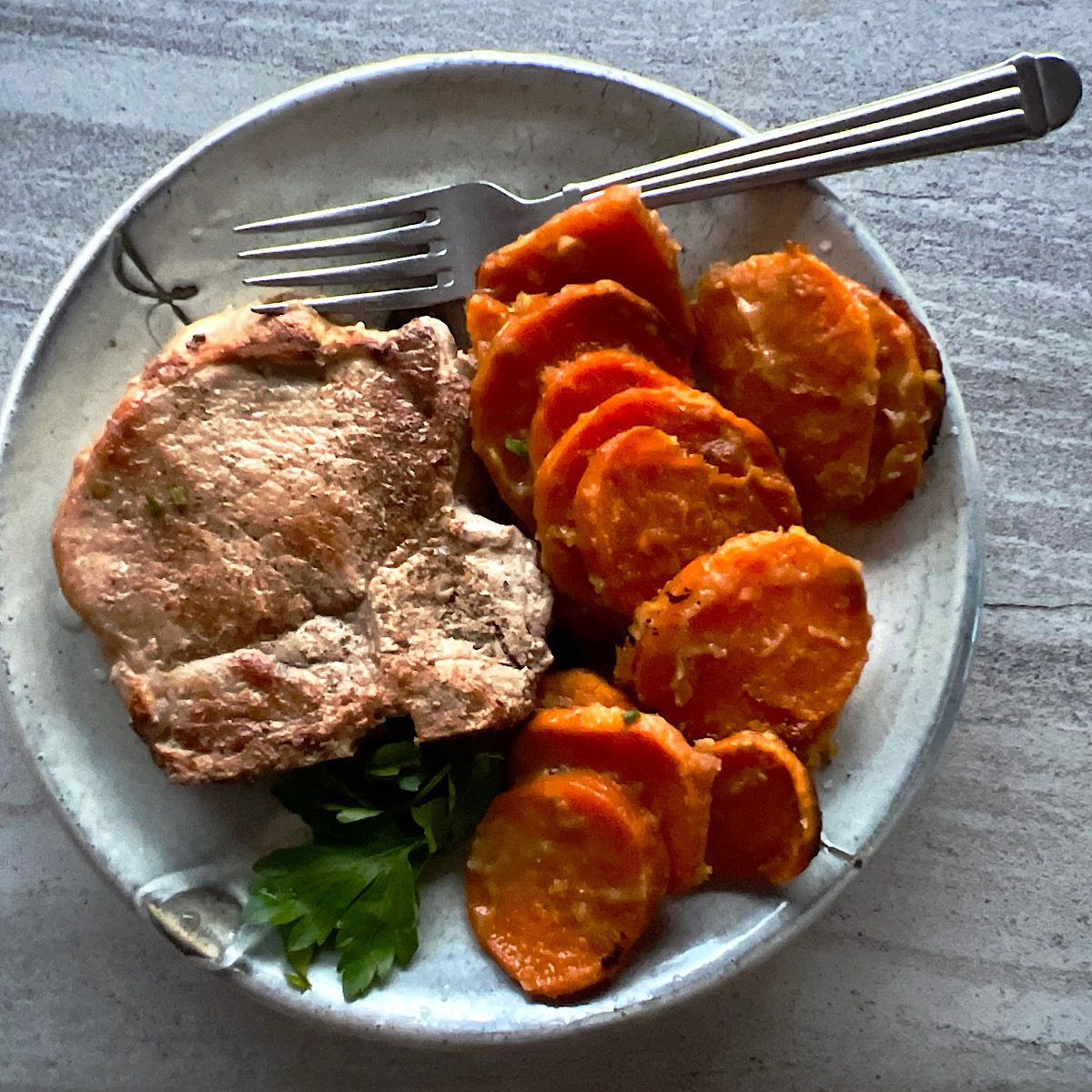 Ginger lime sweet potatoes with a sautéed pork chop