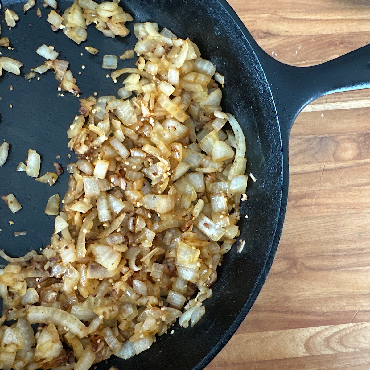 Chopped onions in skillet caramelized in the chorizo fat.