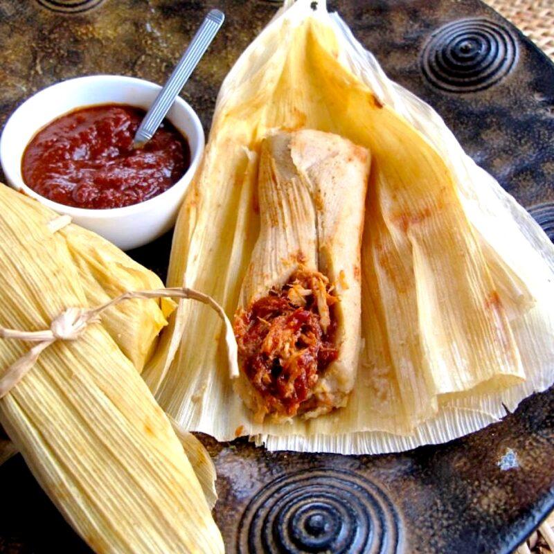 Open tamale showing the inside filling