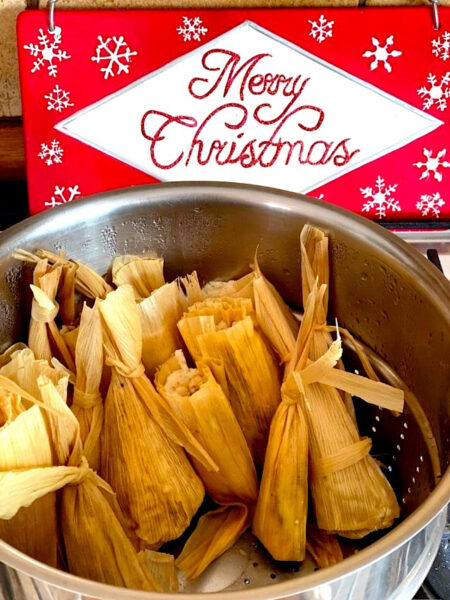 Wrapped tamales in a steamer pot