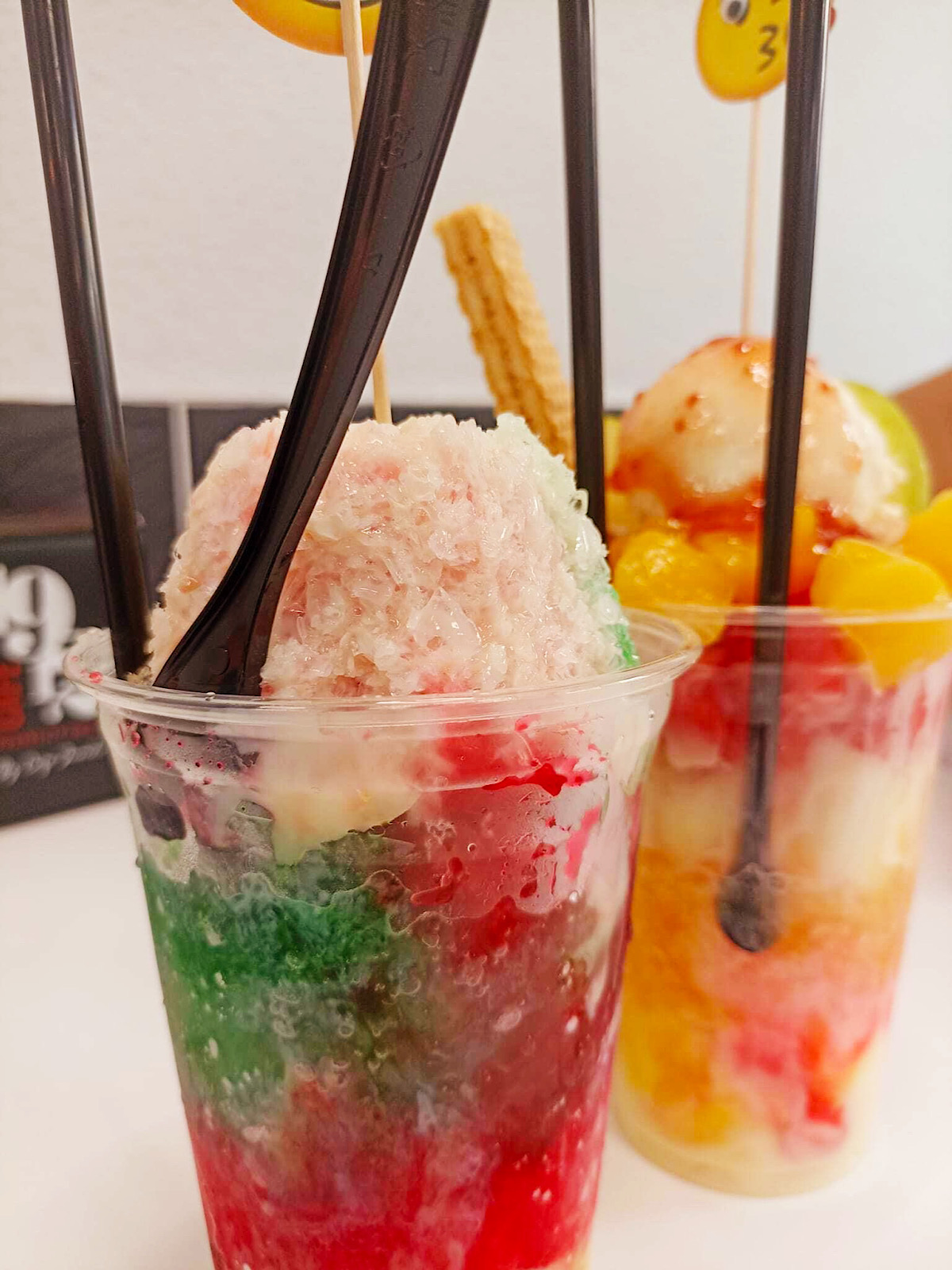 Two variations of raspado (like a fruit snow cone) from a cafe in Spain.