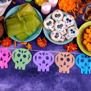 Día De Los Muertos celebration food and decorations.
