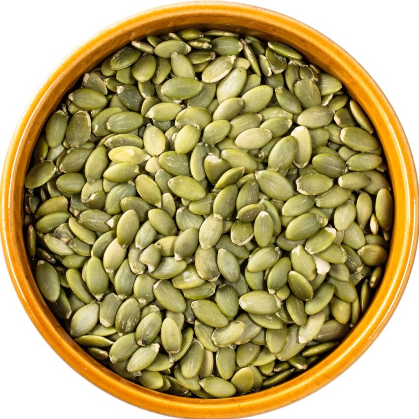 Bowl of pepitas (hull-less pumpkin seeds).