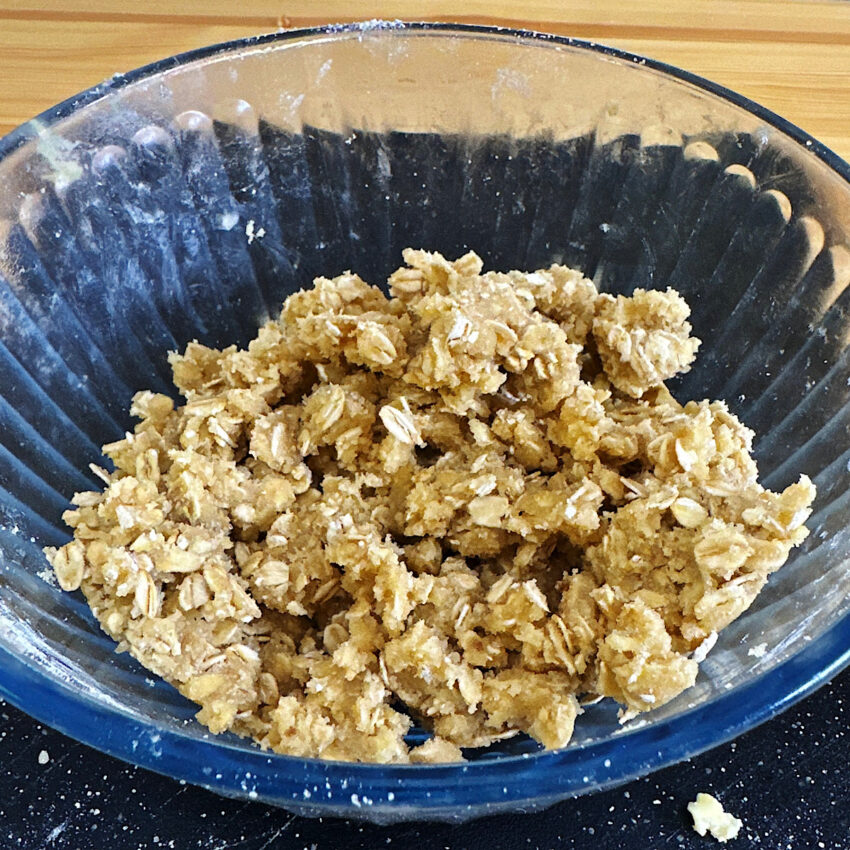 Bowl of mixed together topping ingredients for a crisp or crumble.