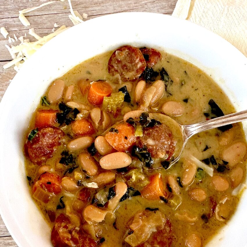 Bowl of Italian white bean, sausage and kale stew.